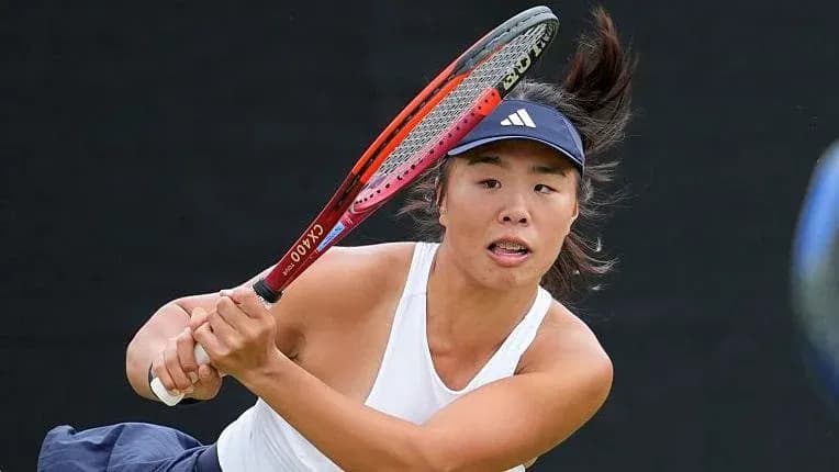 Tennis player hitting a backhand shot Tennis player hitting a backhand shot