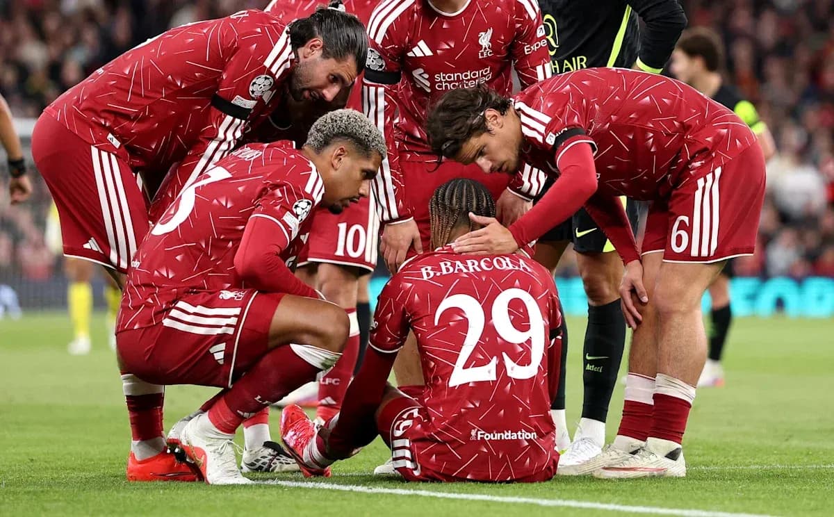 Liverpool players gathered around injured teammate Liverpool players gathered around injured teammate