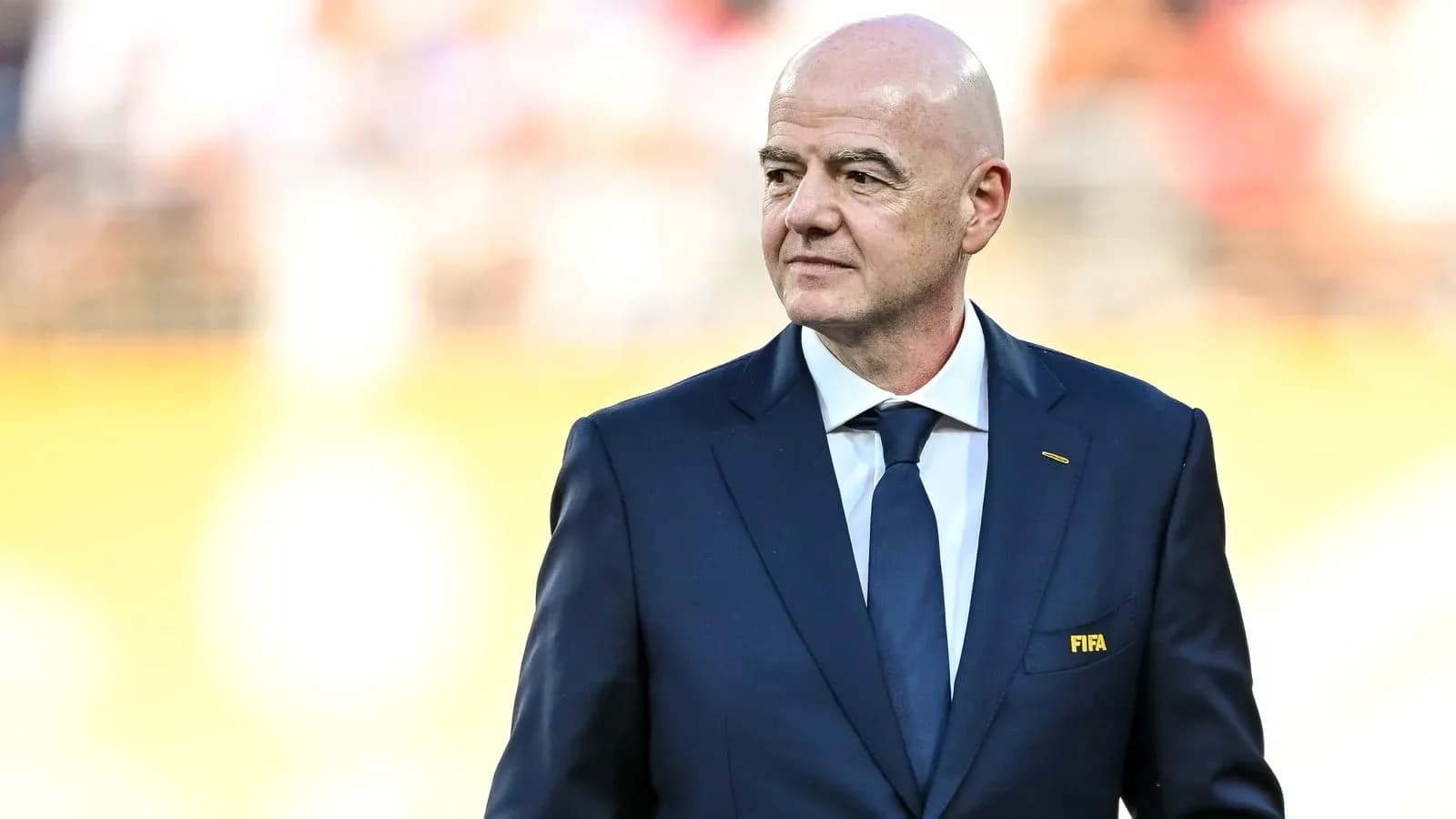 FIFA president walking on the field during event FIFA president walking on the field during event