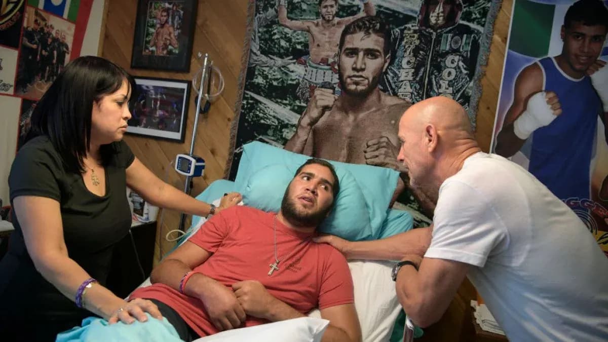 Young man in hospital bed with family members Young man in hospital bed with family members