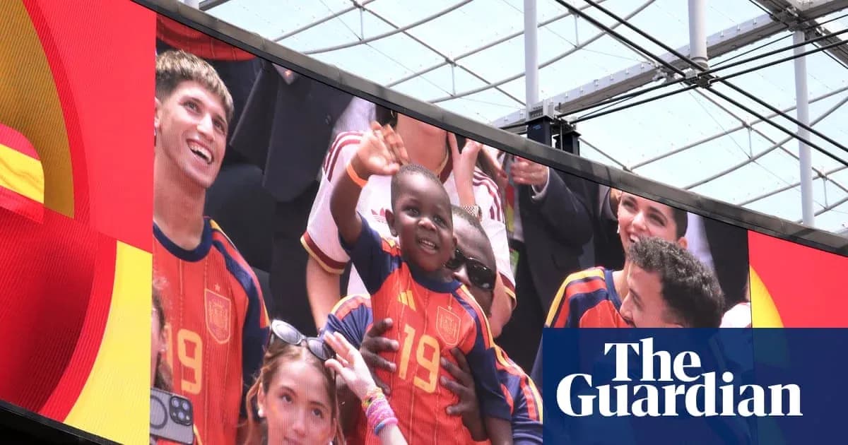 Fans celebrating with a child in Spain jersey Fans celebrating with a child in Spain jersey