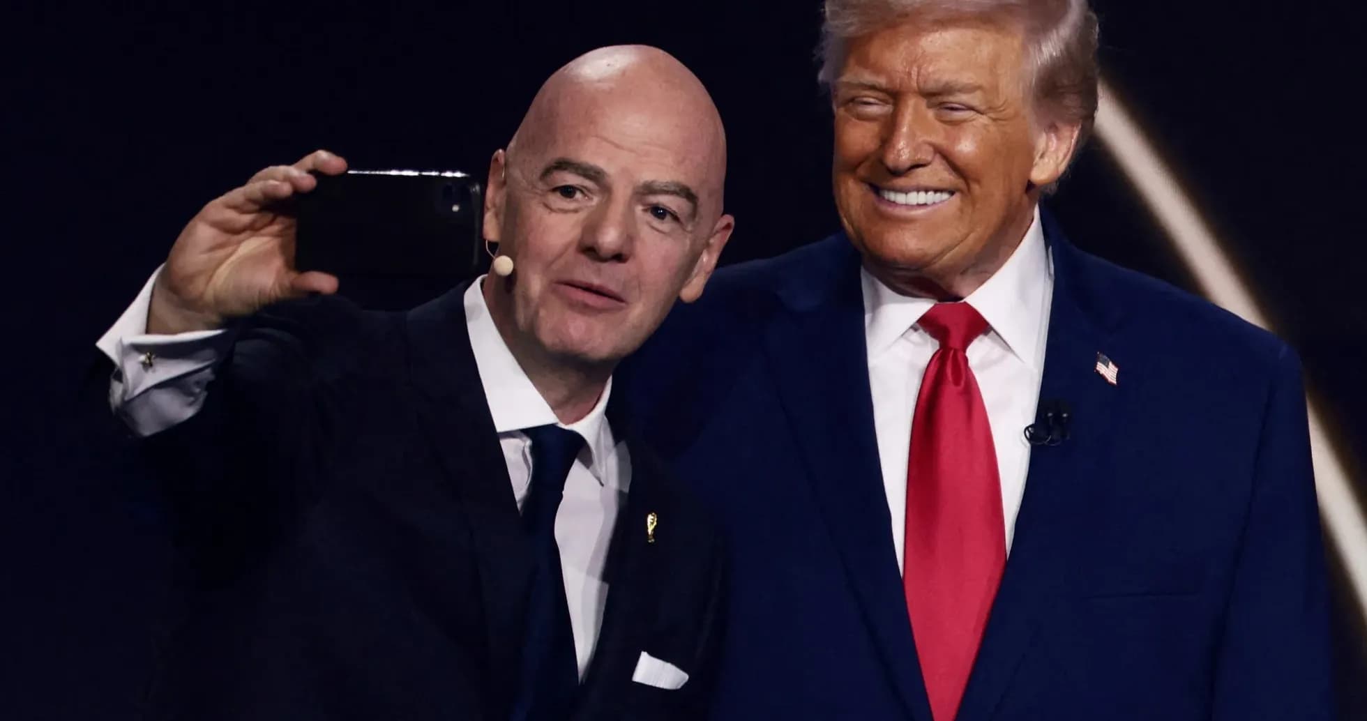 Two men taking a selfie at an event Two men taking a selfie at an event