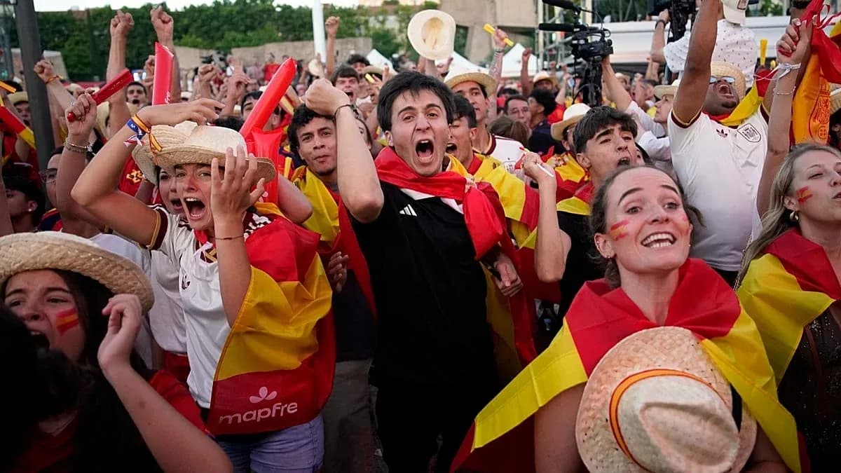 Fans celebrating with Spanish flags at event Fans celebrating with Spanish flags at event