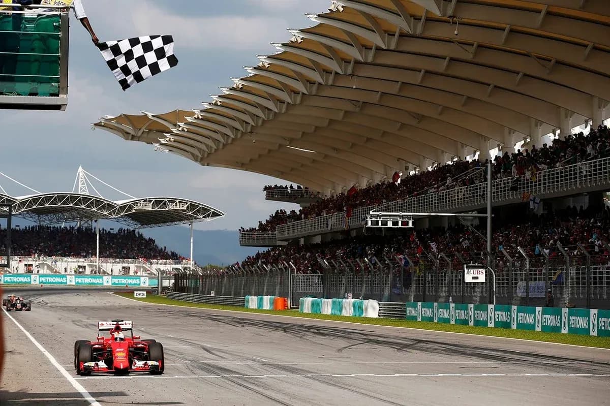 F1 car crossing finish line with checkered flag F1 car crossing finish line with checkered flag