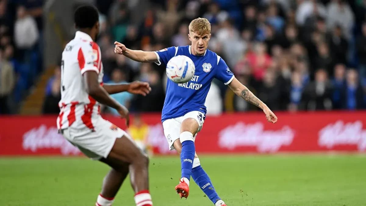 Cardiff City player shooting the ball during match Cardiff City player shooting the ball during match