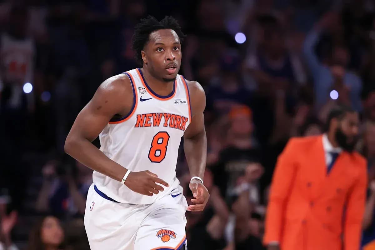 Basketball player running on court for New York Knicks Basketball player running on court for New York Knicks