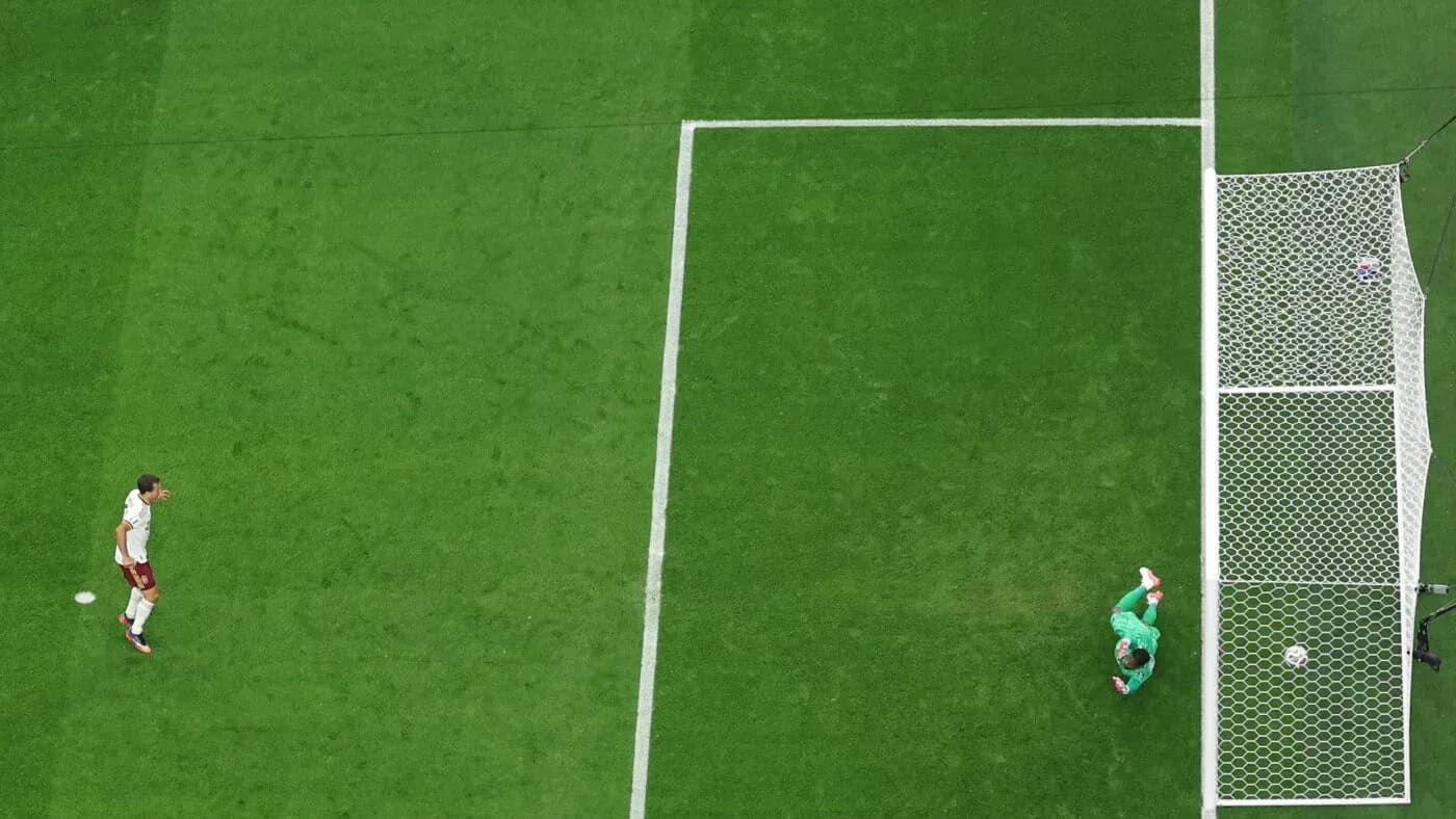 Goalkeeper diving to save a shot on goal Goalkeeper diving to save a shot on goal