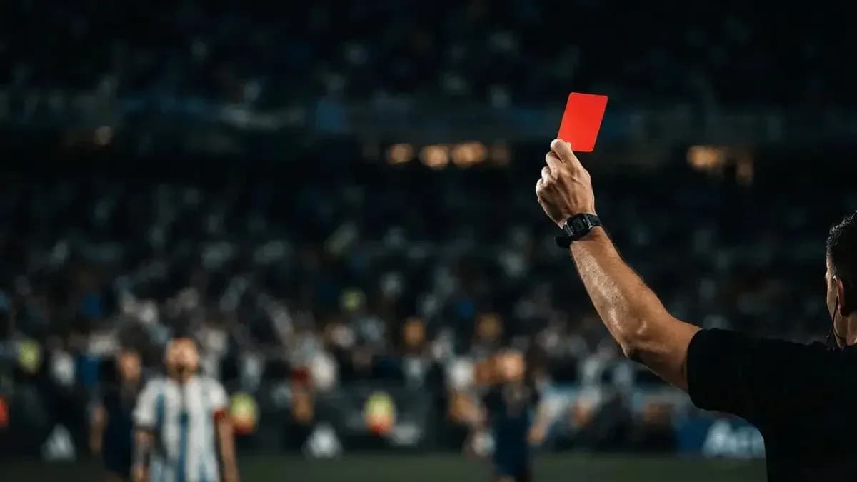 Referee showing red card during football match Referee showing red card during football match