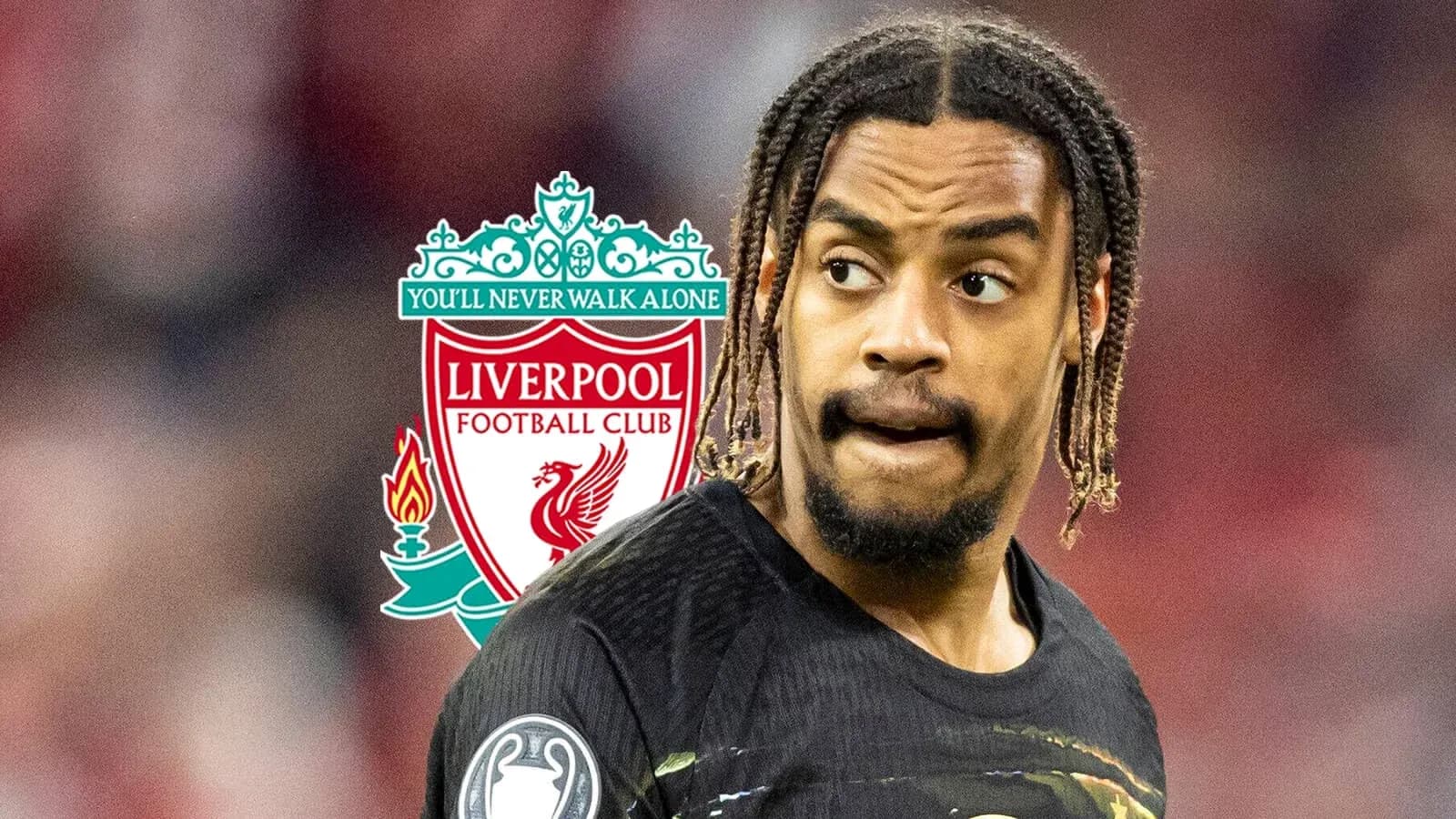 Futbolchi Liverpool logosi oldida turibdi Futbolchi Liverpool logosi oldida turibdi