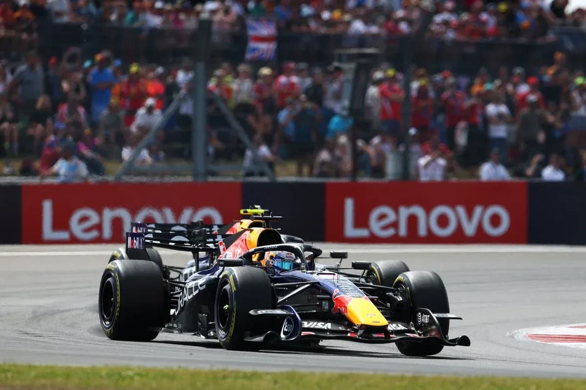 Formula 1 car racing on track with spectators Formula 1 car racing on track with spectators