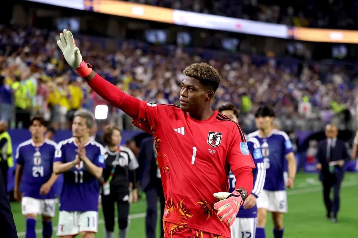 Goalkeeper waving to fans after match conclusion Goalkeeper waving to fans after match conclusion