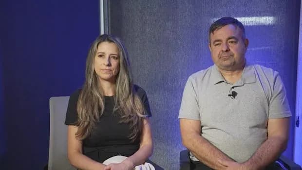 Two individuals seated for an interview Two individuals seated for an interview