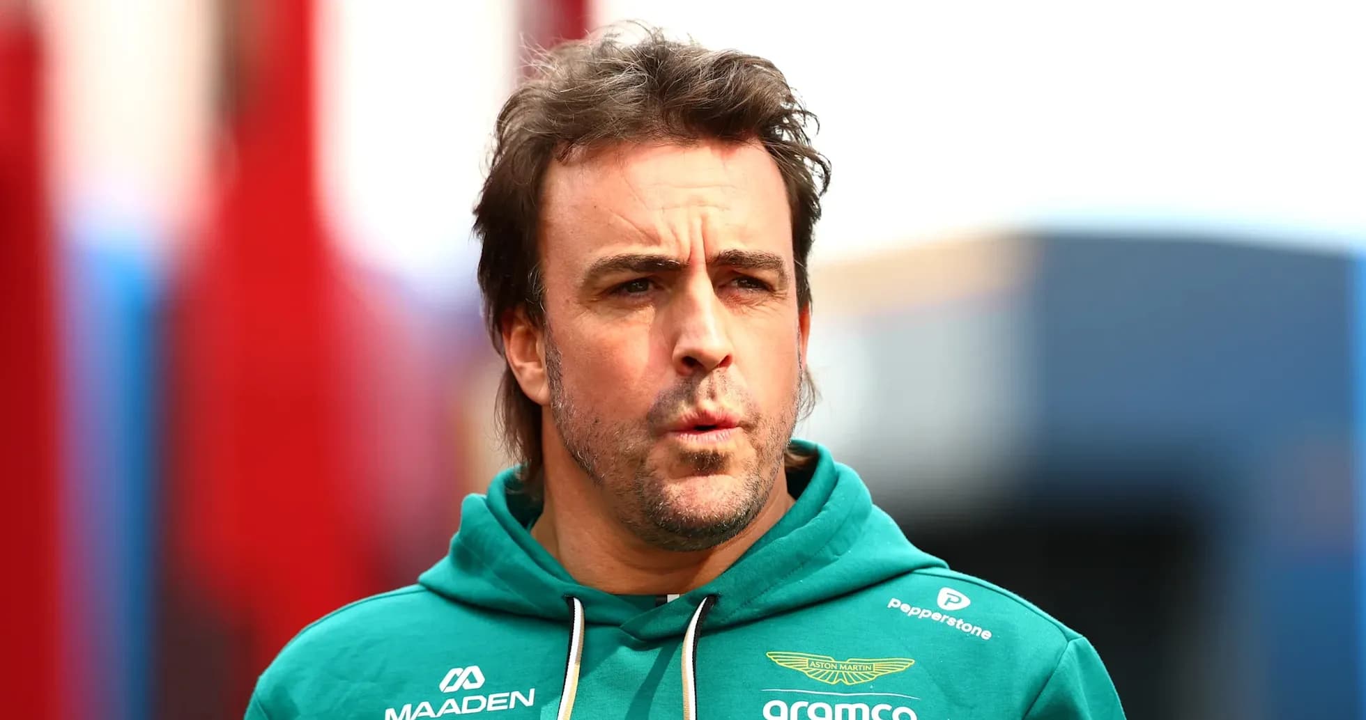 Formula 1 driver in Aston Martin hoodie Formula 1 driver in Aston Martin hoodie