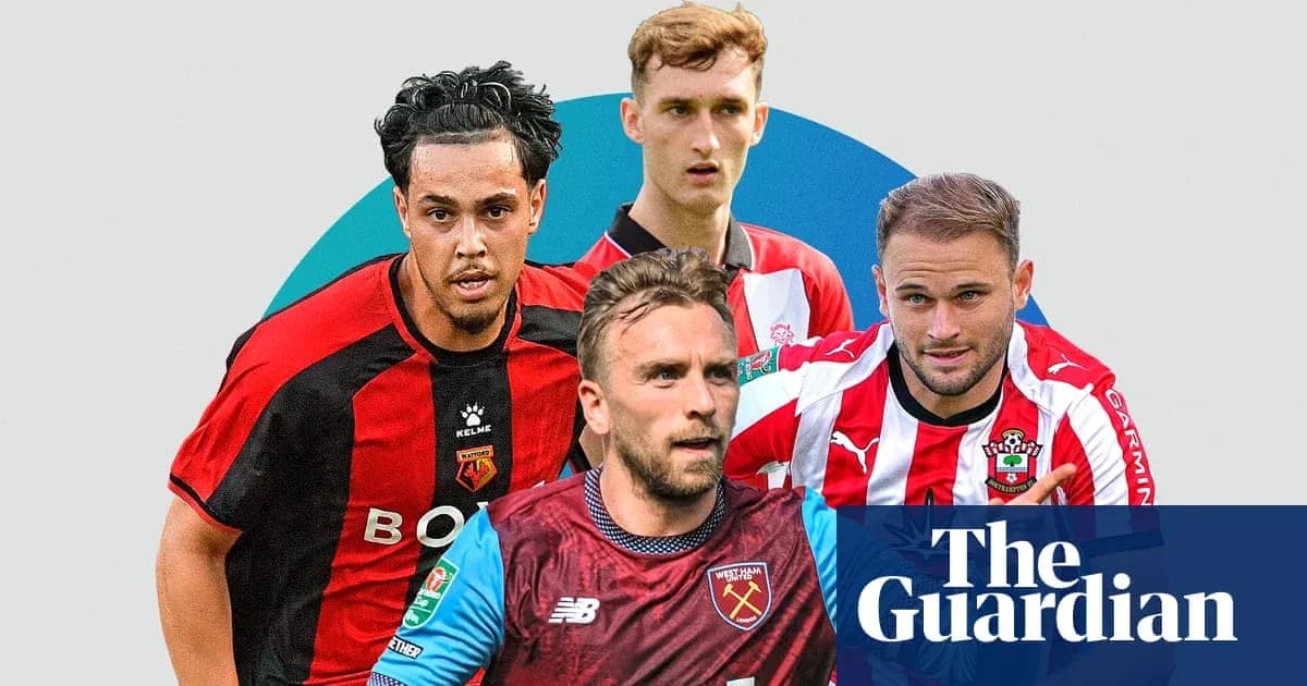 Four football players from different teams posing together Four football players from different teams posing together
