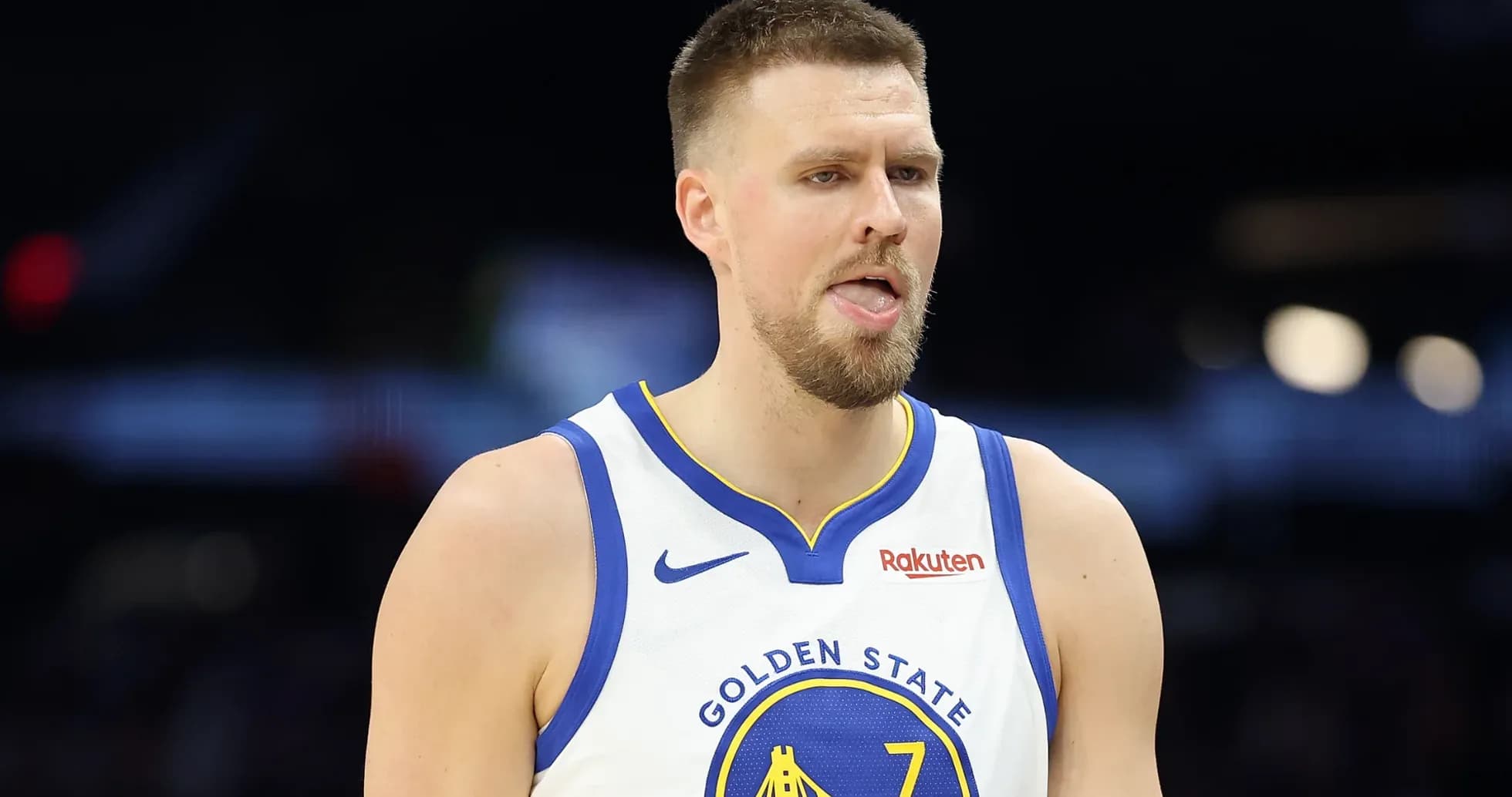 Basketball player in Golden State jersey during game Basketball player in Golden State jersey during game