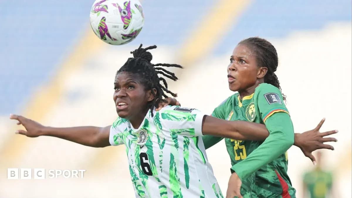 Two players contesting for the ball during match Two players contesting for the ball during match