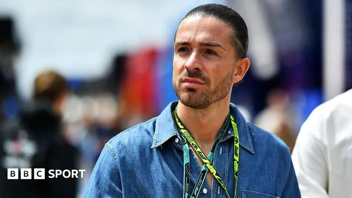 Man wearing denim shirt at motorsport event Man wearing denim shirt at motorsport event