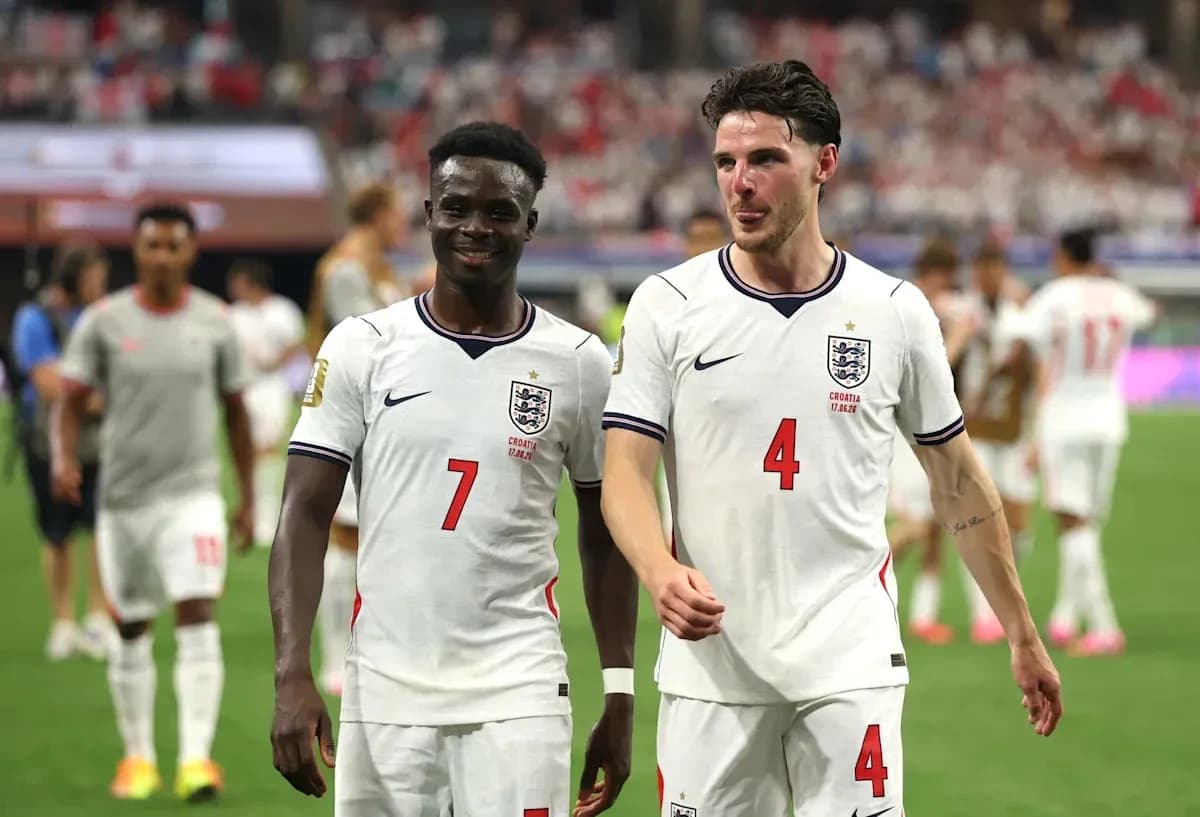 Two England players walking off the pitch together Two England players walking off the pitch together