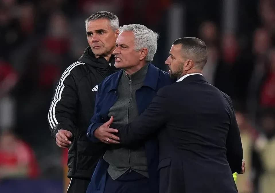 Jose Mourinho being restrained by staff during match Jose Mourinho being restrained by staff during match