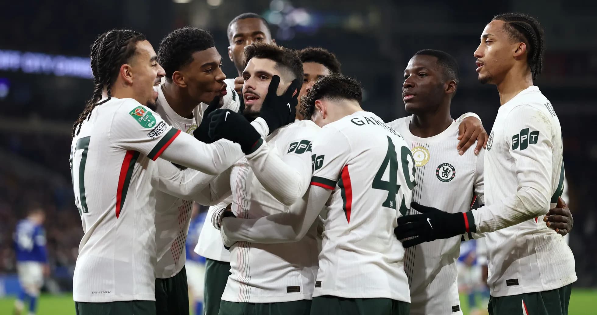 Chelsea players celebrating a goal together Chelsea players celebrating a goal together