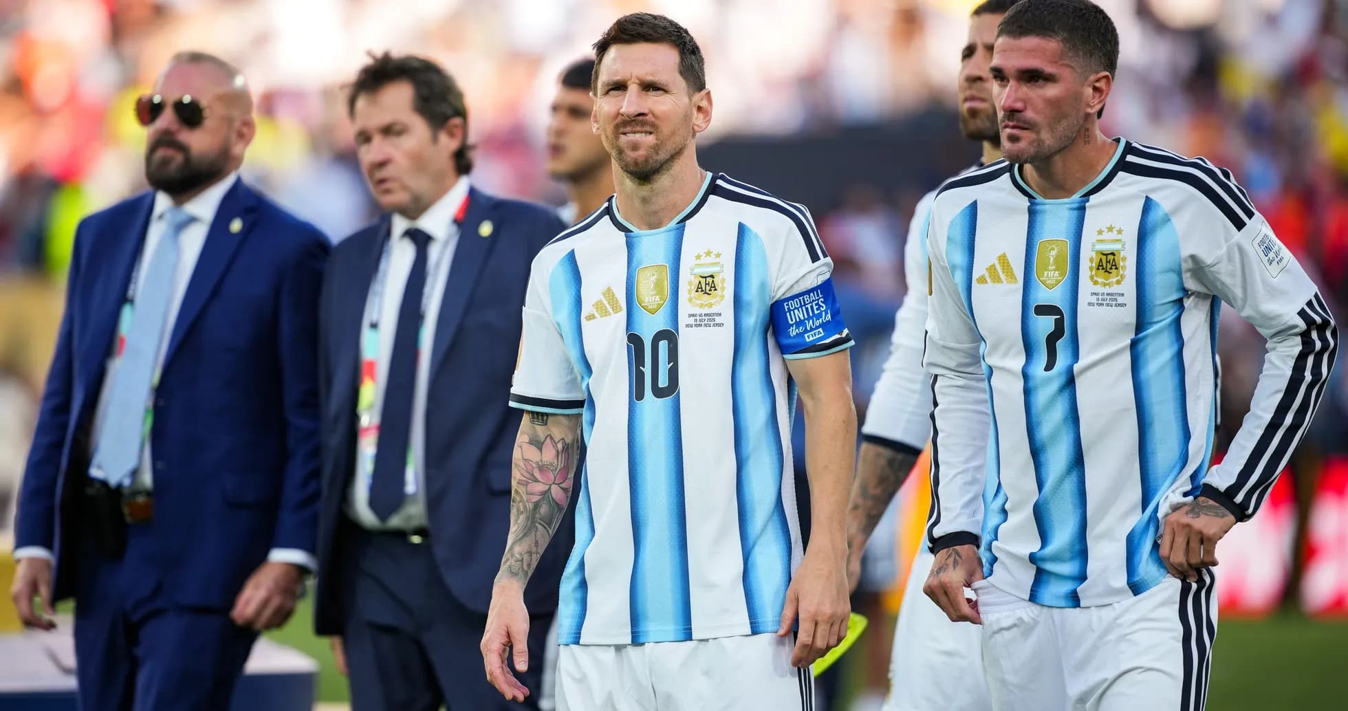Lionel Messi and teammates walking off the field Lionel Messi and teammates walking off the field