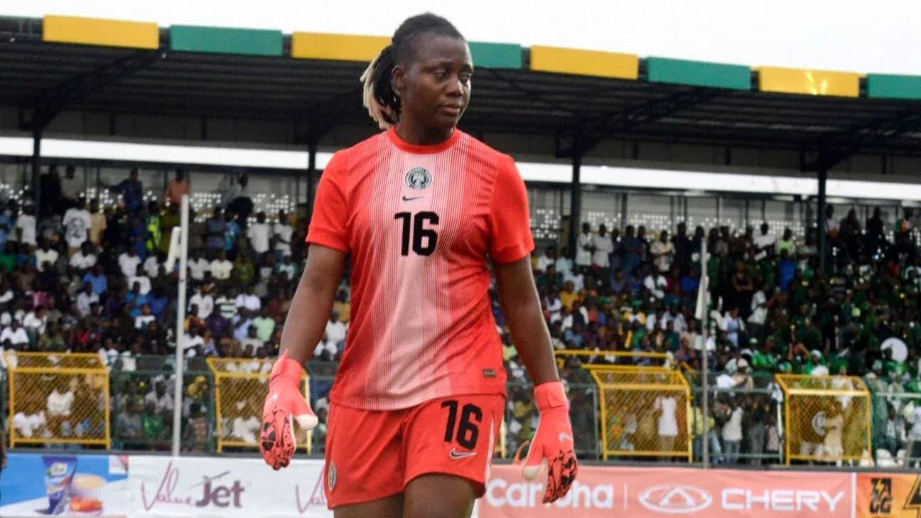 Goalkeeper walking on pitch during match Goalkeeper walking on pitch during match