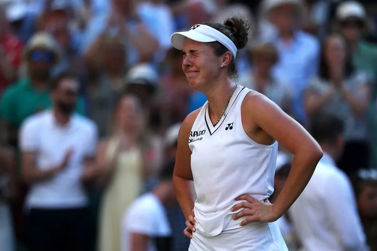 Tennis player reacting during a match with crowd behind Tennis player reacting during a match with crowd behind