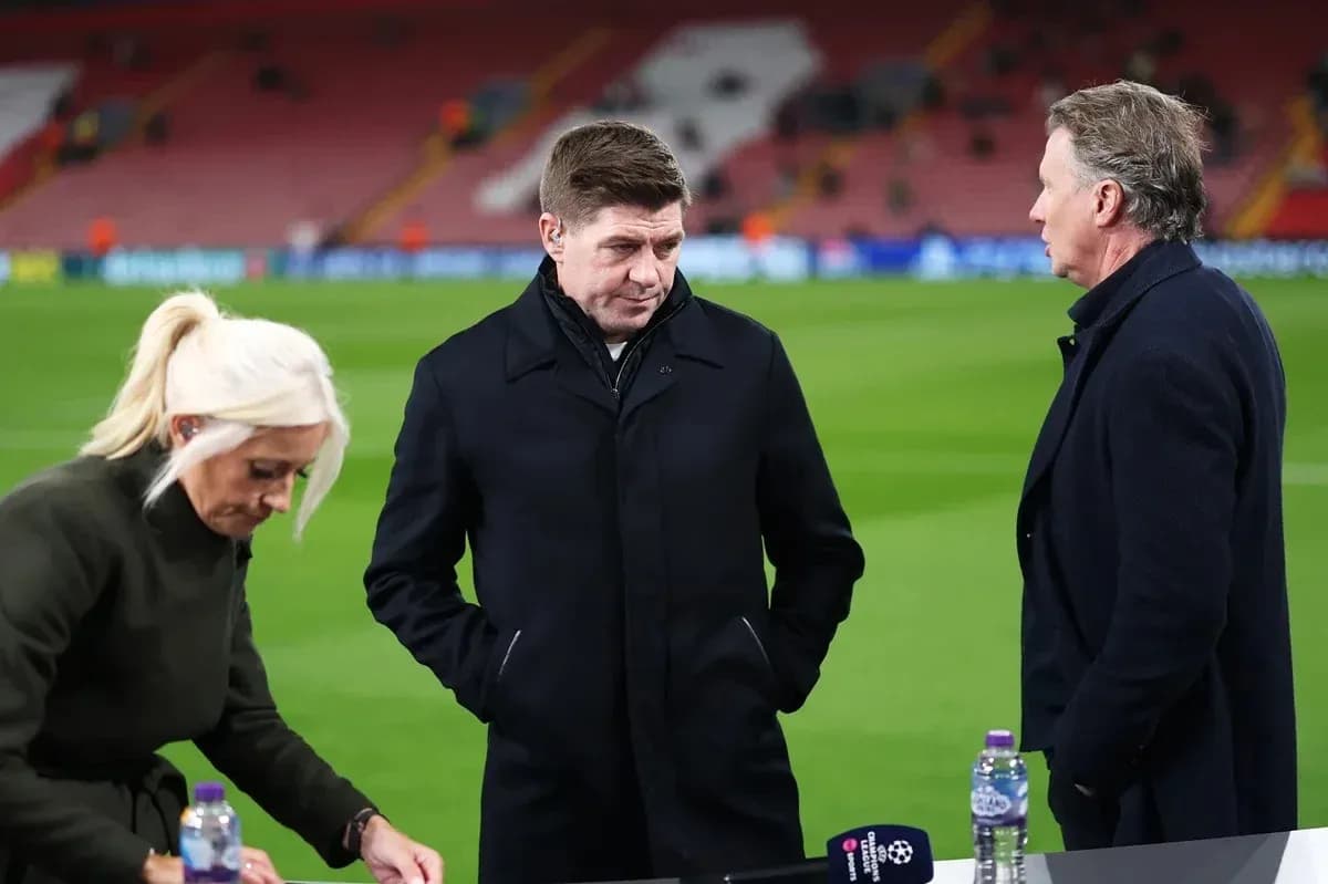 Three analysts discussing on the pitch before match Three analysts discussing on the pitch before match