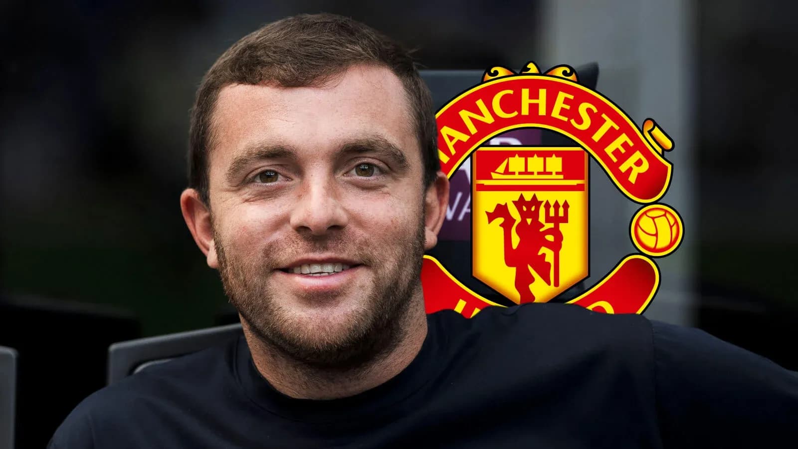 Shirtless man smiling with Manchester United logo behind Shirtless man smiling with Manchester United logo behind