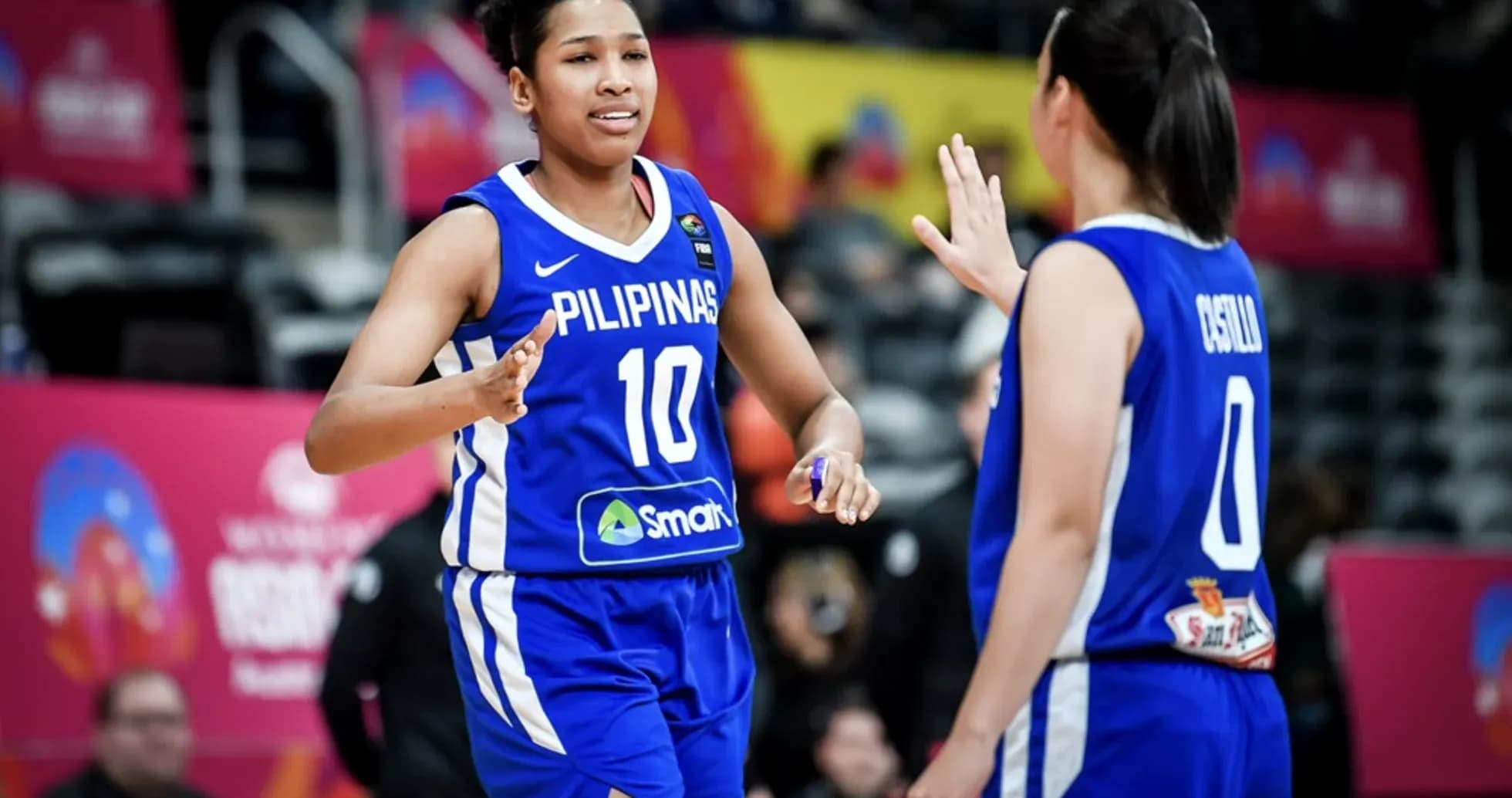 Filipinas players celebrating during basketball match Filipinas players celebrating during basketball match