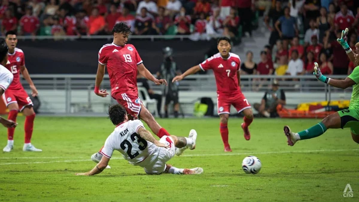 Player sliding for the ball during soccer match Player sliding for the ball during soccer match