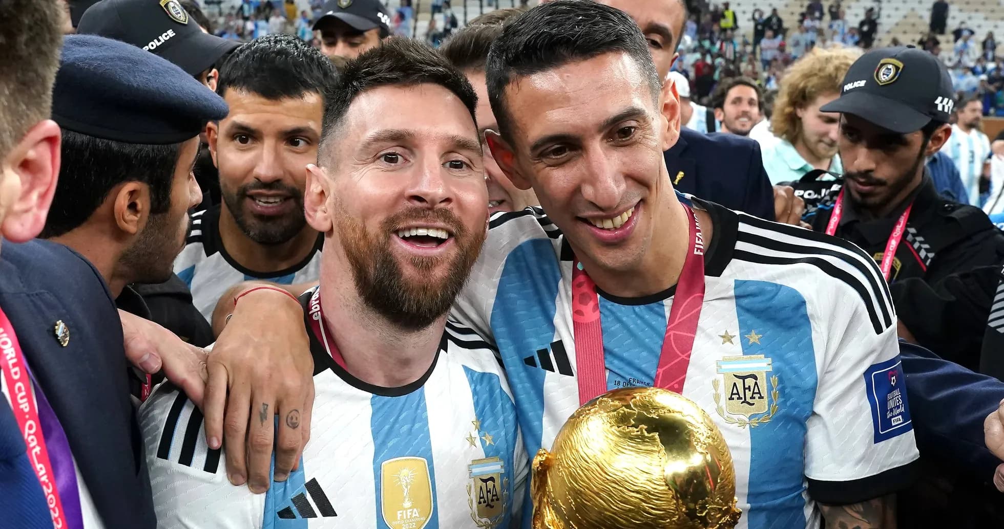 Lionel Messi and Ángel Di María celebrating with trophy Lionel Messi and Ángel Di María celebrating with trophy