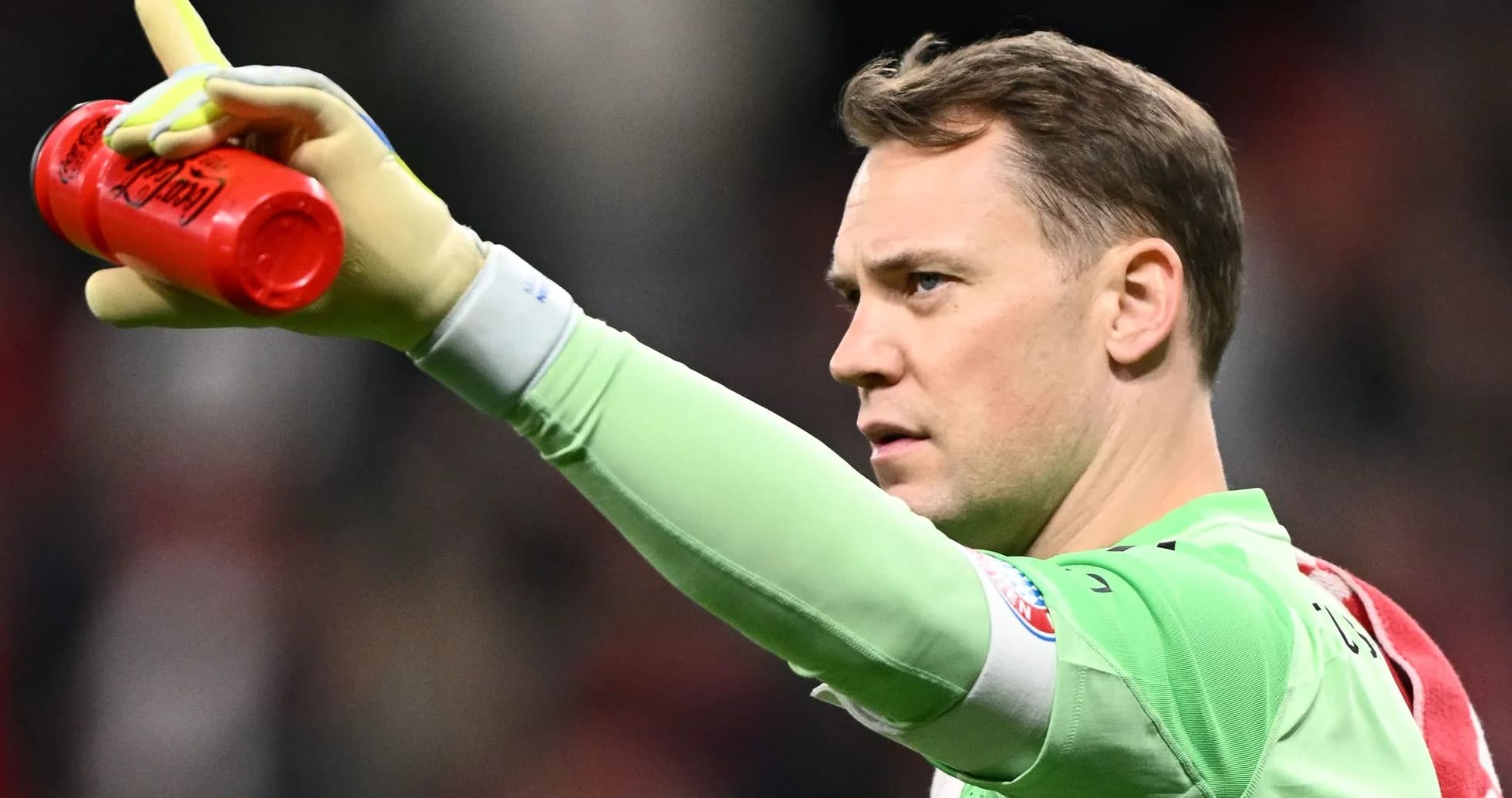 Goalkeeper signaling with drink bottle during match Goalkeeper signaling with drink bottle during match